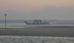Manta Ray car ferry to Frazer Island in morning smoke